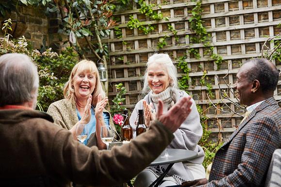 Elderly people having a meet up in the garden